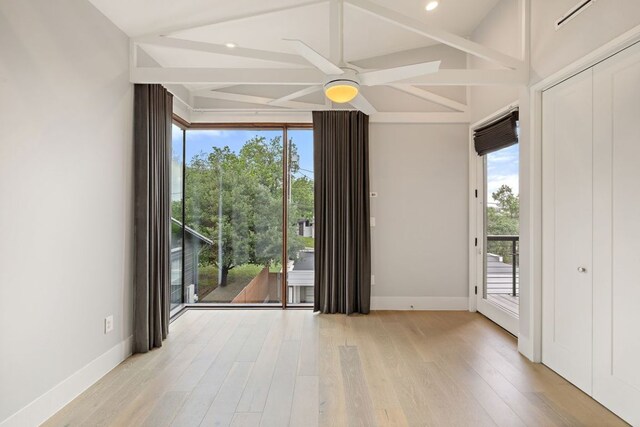 607 Terrell Hill Dr Unit B, Austin, TX 78704 - empty room with light wood-type flooring, ceiling fan, baseboards, beam ceiling, and recessed lighting