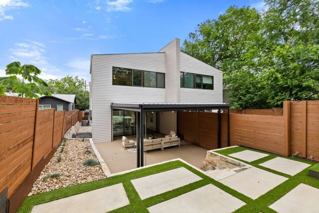 607 Terrell Hill Dr Unit B, Austin, TX 78704 - back of house with a patio, a fenced backyard, and outdoor lounge area