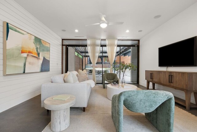 607 Terrell Hill Dr Unit B, Austin, TX 78704 - living room with wooden walls, a ceiling fan, and recessed lighting