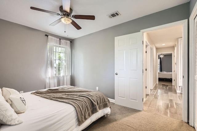 906 Hermitage Dr, Austin, TX 78753 - bedroom with light carpet, baseboards, and a ceiling fan