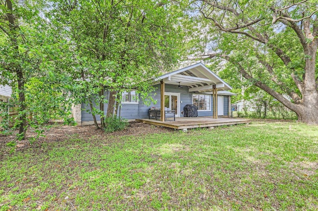 906 Hermitage Dr, Austin, TX 78753 - rear view of property with a deck and a lawn