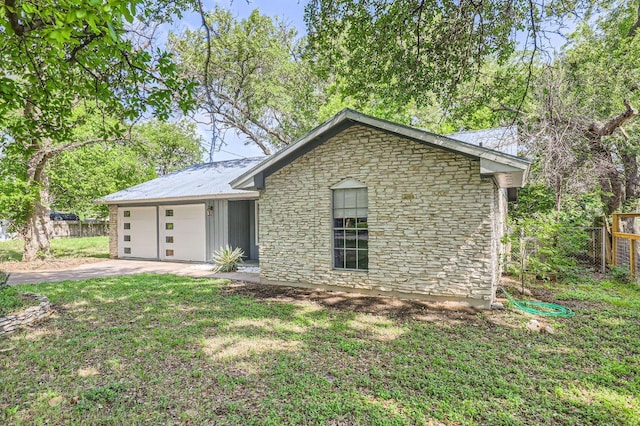 906 Hermitage Dr, Austin, TX 78753 - view of front of house featuring a garage, stone siding, and driveway