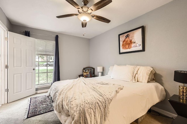 906 Hermitage Dr, Austin, TX 78753 - carpeted bedroom with baseboards and a ceiling fan