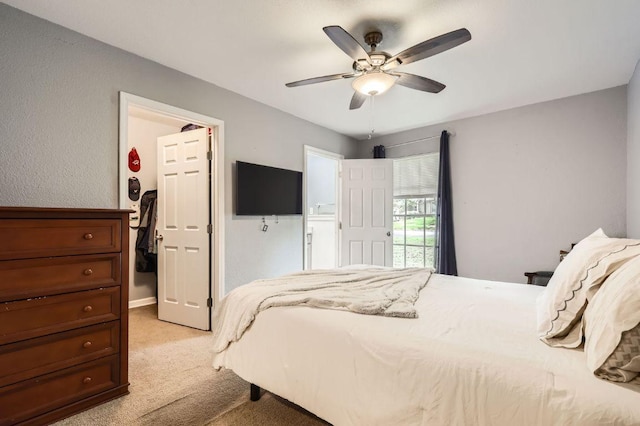 906 Hermitage Dr, Austin, TX 78753 - bedroom with light carpet and a ceiling fan