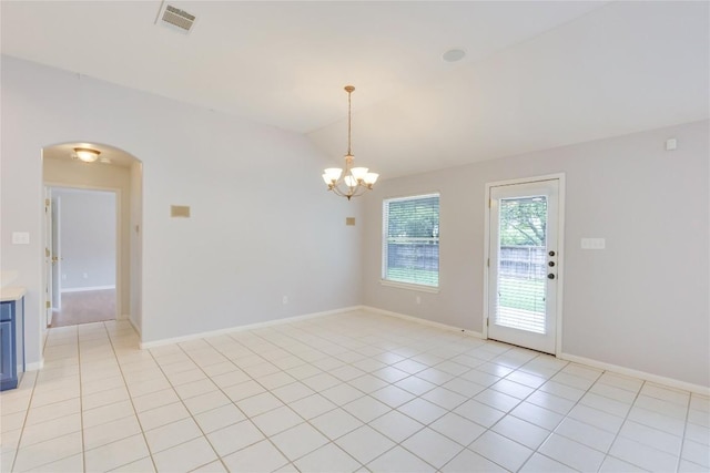 1012 Klondike Loop, Round Rock, TX 78665 - unfurnished room with arched walkways, a chandelier, light tile patterned floors, and vaulted ceiling