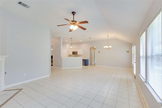1012 Klondike Loop, Round Rock, TX 78665 - unfurnished living room with a chandelier, vaulted ceiling, ceiling fan, light tile patterned flooring, and healthy amount of natural light