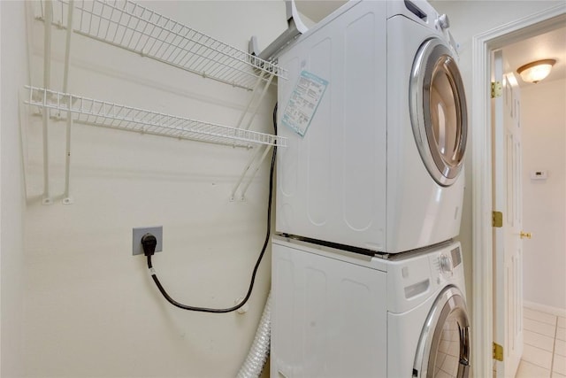 1012 Klondike Loop, Round Rock, TX 78665 - laundry room featuring stacked washing machine and dryer and light tile patterned floors
