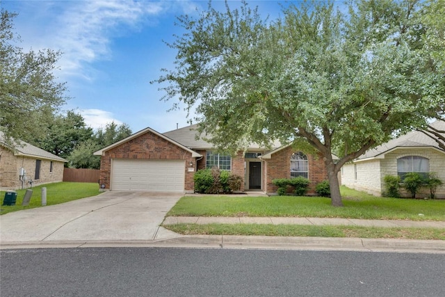 1012 Klondike Loop, Round Rock, TX 78665 - view of front facade featuring a garage, driveway, and brick siding