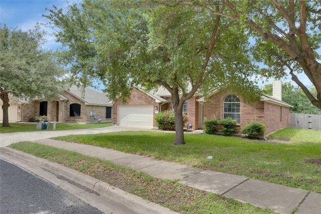 1012 Klondike Loop, Round Rock, TX 78665 - obstructed view of property featuring a garage, a chimney, brick siding, and concrete driveway