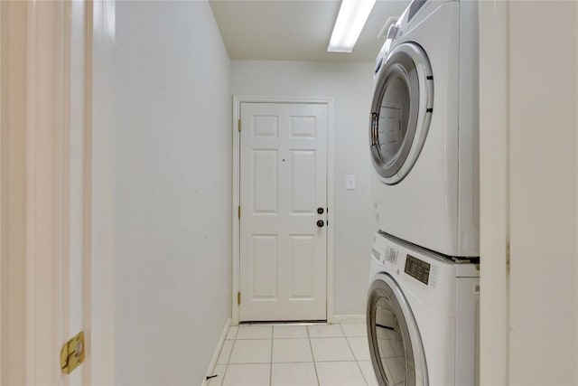 1012 Klondike Loop, Round Rock, TX 78665 - laundry area featuring stacked washer / dryer and light tile patterned floors