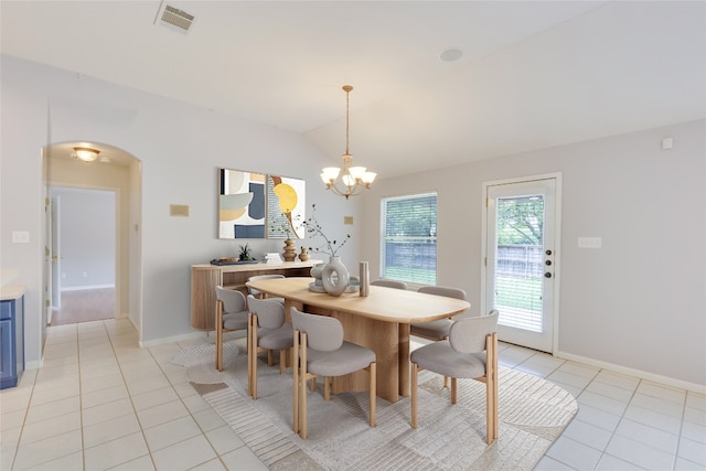 1012 Klondike Loop, Round Rock, TX 78665 - dining area with light tile patterned flooring, a chandelier, arched walkways, and lofted ceiling
