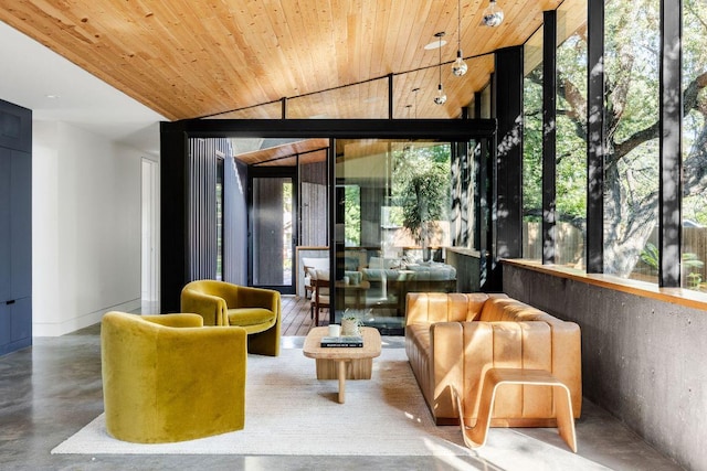 lobby with wooden ceiling, a wall of windows, and lofted ceiling