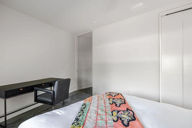 bedroom with concrete floors