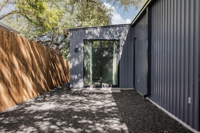 view of outbuilding with fence