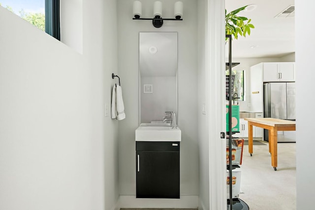 1405 Perez St Unit 2, Austin, TX 78721 - corridor with a sink and light colored carpet
