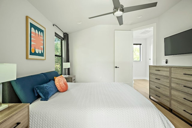 1405 Perez St Unit 2, Austin, TX 78721 - bedroom with light wood finished floors, a ceiling fan, and vaulted ceiling