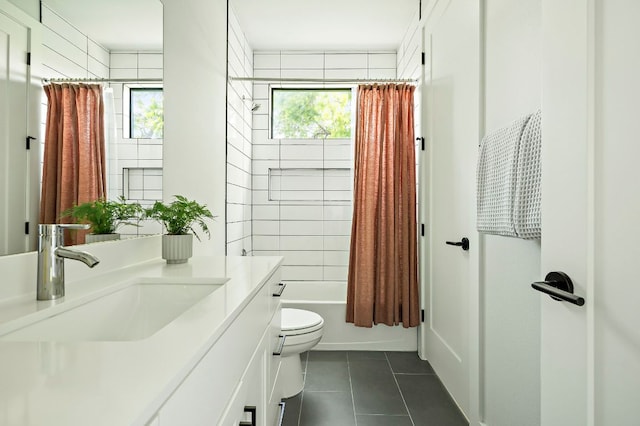bathroom with tile patterned flooring, toilet, shower / tub combo, and vanity