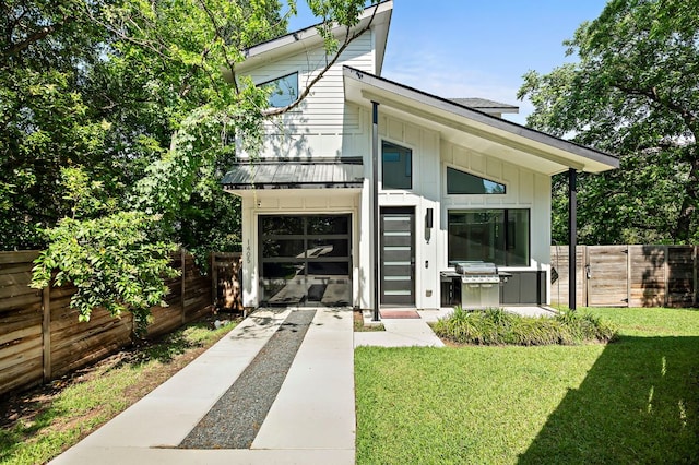 1405 Perez St Unit 2, Austin, TX 78721 - view of front of house with board and batten siding