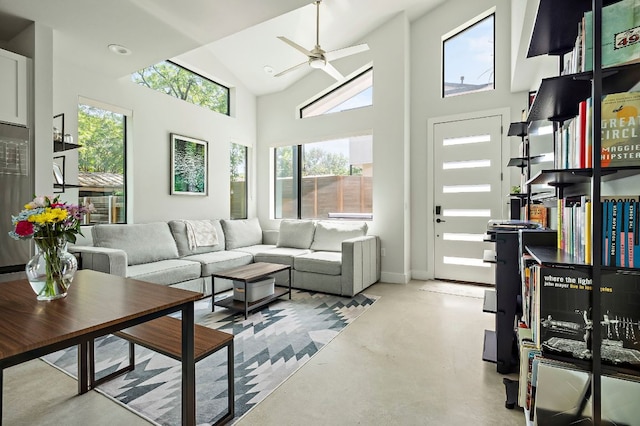 1405 Perez St Unit 2, Austin, TX 78721 - living area featuring concrete floors, a ceiling fan, and high vaulted ceiling