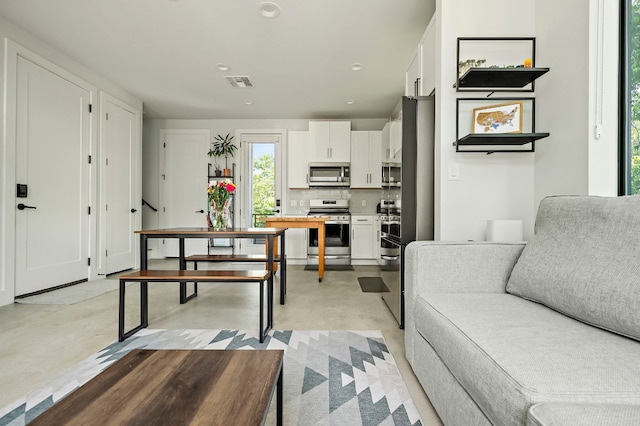 1405 Perez St Unit 2, Austin, TX 78721 - living room featuring recessed lighting and concrete floors