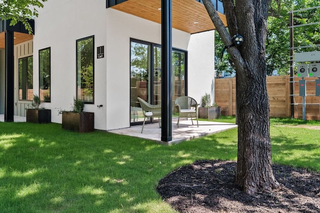 517 Tillery St Unit 1, Austin, TX 78702 - rear view of property featuring stucco siding and a patio area