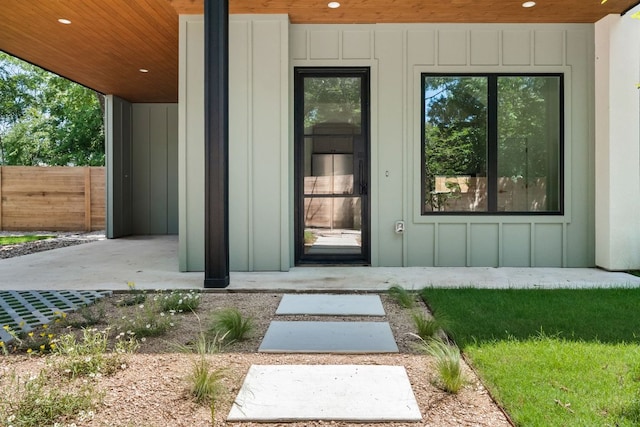 517 Tillery St Unit 1, Austin, TX 78702 - doorway to property featuring board and batten siding