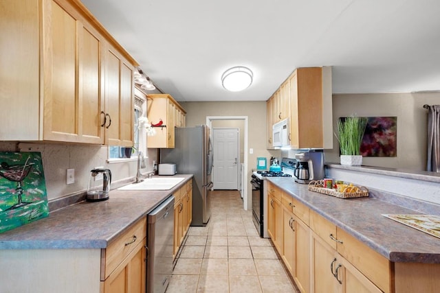 8017 Gault St, Austin, TX 78757 - kitchen featuring appliances with stainless steel finishes, light brown cabinetry, a sink, light tile patterned floors, and dark countertops