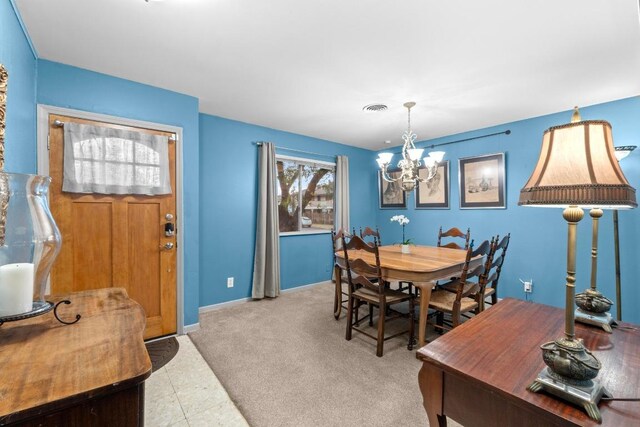 8017 Gault St, Austin, TX 78757 - dining space featuring a chandelier and baseboards