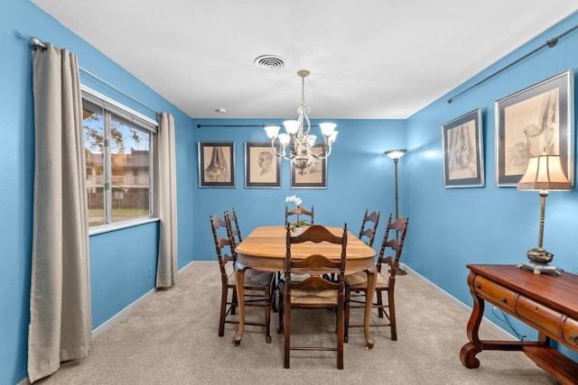 8017 Gault St, Austin, TX 78757 - dining space featuring a chandelier and carpet flooring