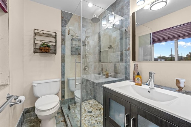 8017 Gault St, Austin, TX 78757 - full bath with toilet, vanity, a shower stall, and baseboards