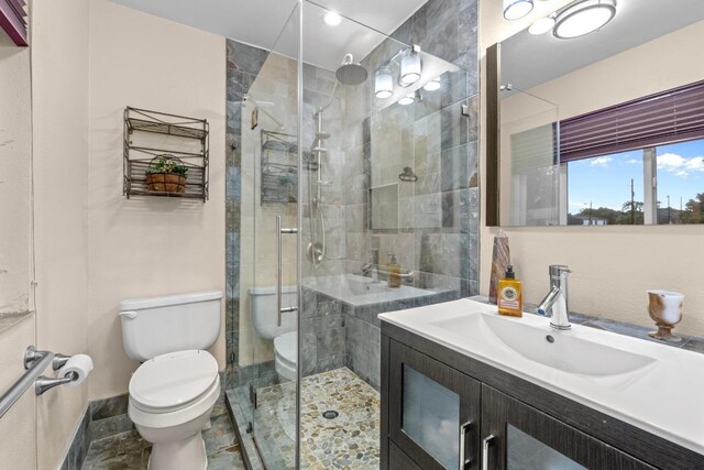 8017 Gault St, Austin, TX 78757 - bathroom featuring vanity and a stall shower