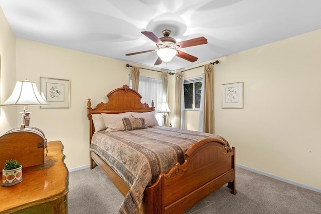 8017 Gault St, Austin, TX 78757 - bedroom featuring carpet floors, baseboards, and a ceiling fan
