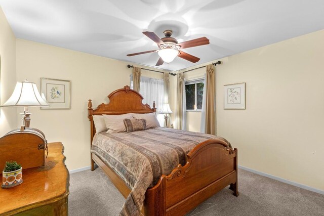 8017 Gault St, Austin, TX 78757 - carpeted bedroom featuring baseboards and ceiling fan