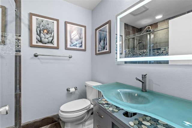 8017 Gault St, Austin, TX 78757 - full bath with a tile shower, vanity, and toilet