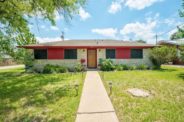 8017 Gault St, Austin, TX 78757 - ranch-style home featuring stone siding, a front lawn, and roof with shingles