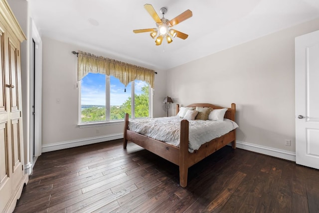 401 Brooks Hollow Rd, Lakeway, TX 78734 - bedroom with wood-type flooring, baseboards, and ceiling fan