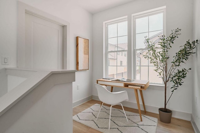 2209 Woodland Ave Unit 101, Austin, TX 78741 - home office featuring plenty of natural light, light wood finished floors, and baseboards