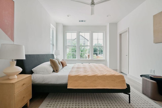 2209 Woodland Ave Unit 101, Austin, TX 78741 - bedroom featuring wood finished floors, baseboards, and a ceiling fan