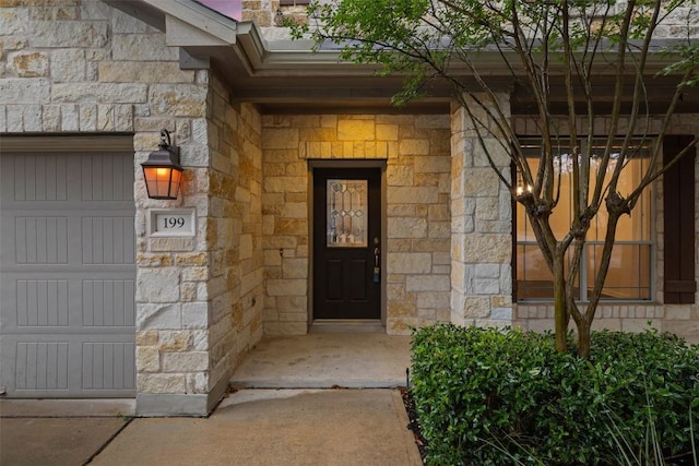 199 Limestone Trl, Austin, TX 78737 - doorway to property featuring stone siding and a garage