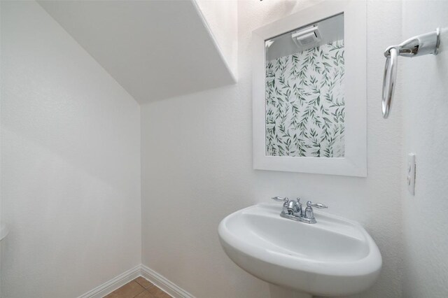 199 Limestone Trl Unit 73, Austin, TX 78737 - bathroom featuring a sink, baseboards, and tile patterned floors