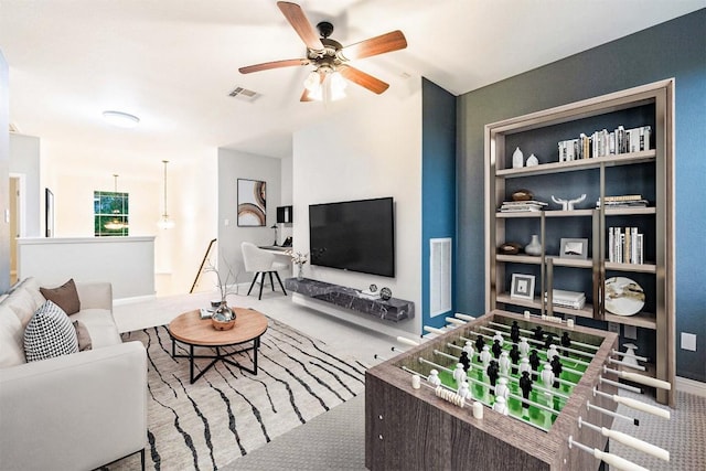 199 Limestone Trl, Austin, TX 78737 - living room featuring carpet, a ceiling fan, and built in features