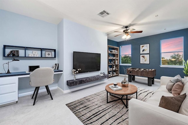 199 Limestone Trl, Austin, TX 78737 - living area featuring carpet flooring, a ceiling fan, and built in study area