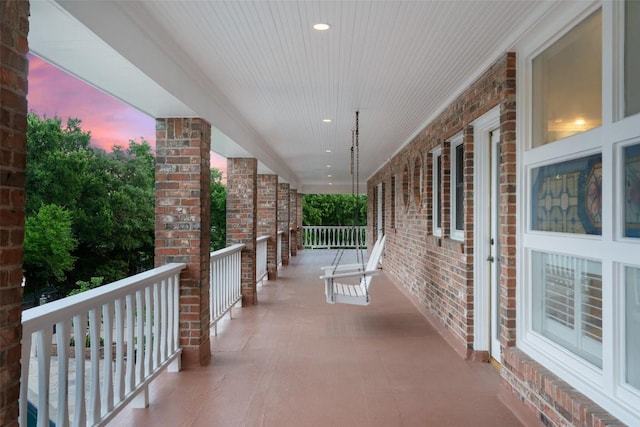 12 Hedge Ln, Austin, TX 78746 - patio terrace at dusk with covered porch