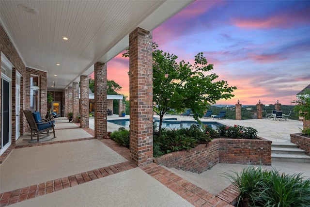 12 Hedge Ln, Austin, TX 78746 - patio terrace at dusk with a pool with connected hot tub