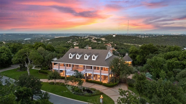 12 Hedge Ln, Austin, TX 78746 - aerial overview of property's location with a heavily wooded area