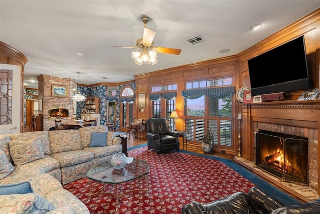 12 Hedge Ln, Austin, TX 78746 - living room featuring a fireplace, ceiling fan, wood finished floors, and crown molding