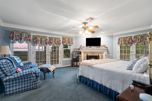 12 Hedge Ln, Austin, TX 78746 - carpeted bedroom featuring french doors, ornamental molding, multiple windows, and access to exterior