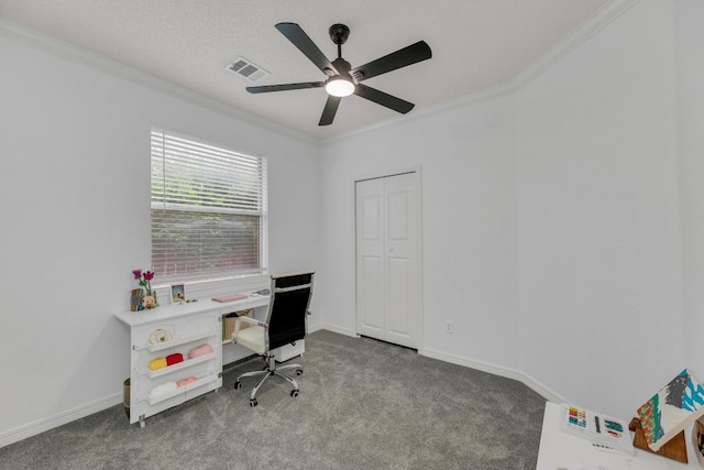 office space featuring crown molding, carpet flooring, a ceiling fan, and baseboards