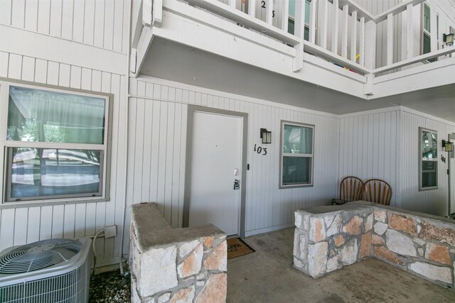 104 Cove E Unit 103, Horseshoe Bay, TX 78657 - entrance to property with central air condition unit and a balcony