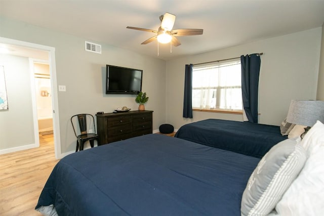 104 Cove E Unit 103, Horseshoe Bay, TX 78657 - bedroom featuring light wood-style flooring, baseboards, and ceiling fan